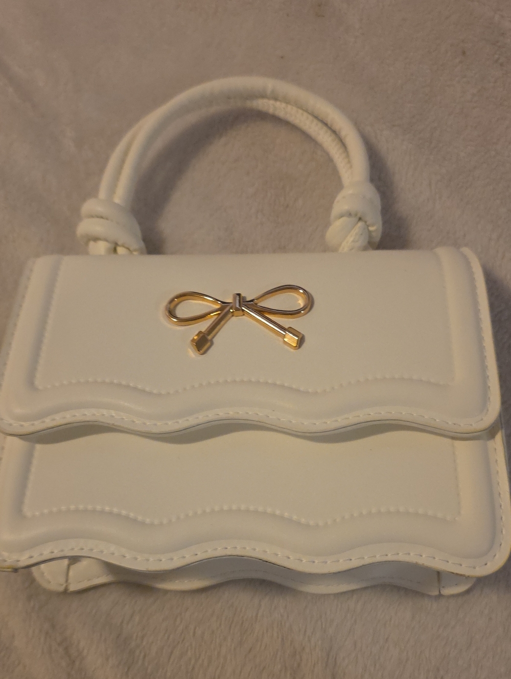 Elegant White Mini Top-Handle Bag with Gold Bow Accent